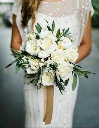 Beautiful Bridal Bouquet Arranged With White Roses White English Garden Roses White Ranunculus Bridal Bouquet Fall Wedding Bouquets White Peonies Bouquet