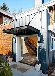 Add Decors To Your Exterior With 20 Awning Ideas Home Design Lover House Exterior Industrial Exterior Exterior Design