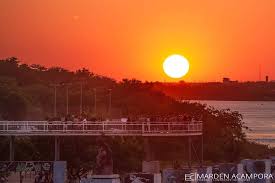 An aerial view of waves crashing against a shore.