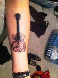 People who play music, sing or have a passion for music generally go for a guitar tattoo. 71 Splendid Guitar Tattoos On Forearm