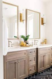 If you are a fan of the transitional style of decorating, bellacor's 1 light and 2 light wall fixtures in burnished gold, winter gold, honey gold and bronze gold shades are just some of the options you can choose from. Mixing Metal Finishes In The Bathroom Centsational Style