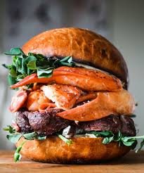Black Blue Steak And Crab Buffalo Ny Surf Turf Lobster Burger With Spicy Goat Cheese Cilantro Butter Foodandwine Lobster And Burger Seafood Recipes Wine Recipes
