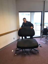 With its 34'' wide seat, this is truly a chair and a half. I Found A Ridiculously Large Chair At Work Today Funny