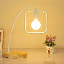 A banded square shade adds a contemporary touch to the rustic style of this table lamp. Industrial Table Lamp With Square Metal Frame And Wooden Lamp Base In Black White Beautifulhalo Com