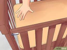 Attach the drop side rail to the front of the crib put the side drop rod through its designated holes and make sure it is tightly secured on both sides. How To Assemble A Crib 15 Steps With Pictures Wikihow