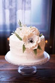 Please don't let the above put you off using& fresh flowers on wedding cakes because edible flowers on a wedding cake are stunning and a cheaper alternative to a lot of fancy sugar work. One Tier Wedding Cake With White Fondant Flowers Wedding Cakes With Flowers Wedding Cake Fresh Flowers Wedding Cake Toppers