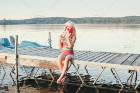 The summer solstice is celebrated in many cultures around the world. Canada Canadian Girl Cute Day Child Caucasian Lake Celebration Kid Water Cute Proud Sunset First Flag Fun Funny July Dock Wave Happy Holiday Independence Pier Outdoor Splash Smiling Maple Nation National Authentic