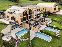 A Luxury Modern Chalet Has A Pool For Each Of Its Suites Modern Architecture Building Architecture Architectural Elements