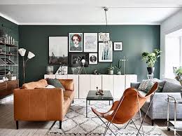 Modern Scandinavian Living Room Design Interior With Green Walls Brown Sofa And Butterfly Chair Living Room Seating Livingroom Layout Living Room Green