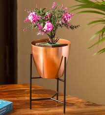 Find detailed information of metal planters, wrought iron planter, copper planters, iron planters, stainless steel planter suppliers for your buy requirements. Buy Copper Iron The Copper Frustum Planter Pot With Triangular Stand By Exclusivelane Online Desk Pots Pots Planters Home Decor Pepperfry Product