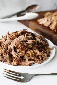 Sprinkle the pork loin on all sides with salt and pepper and place it on top of the onions in the crockpot. Best Slow Cooker Pulled Pork Recipe Downshiftology