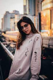 A Lookbook Fashion Shot Of A Female Model Posing Against A Wall Outdoors Fashion Photography Types Business Fashion Fashion Fashion Articles