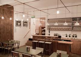 A London Cafe Takes A Shine To Copper Remodelista London Cafe Cafe Interior Commercial Interior Design