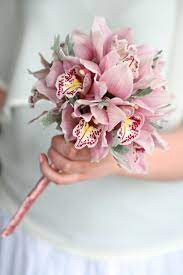 Flower Girl Wand Of Cymbidium Orchids And Silver Senecio Foliage Liberty Blooms Orchids Orchid Bouquet Wedding Flower Girl Wand Winter Wedding Flowers