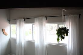 White curtains soften windows, give a touch of privacy and bring warmth to a space without feeling heavy. Enjoy It By Elise Blaha Cripe Bedroom Curtains