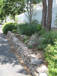 Building A Low Stone Wall For Function And Looks Curbappeal Stone Walls Garden Dry Stone Wall Stacked Stone Walls