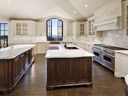 White Kitchen With Dark Stained Island Dark Island Luxury Kitchens Kitchen Layout Kitchen Layouts With Island