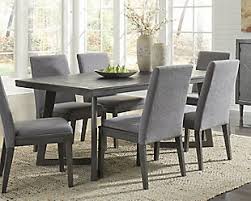 Sleek 3pc dining sets are a suitable choice for a tiny breakfast nook. Besteneer Dining Table Ashley Furniture Homestore