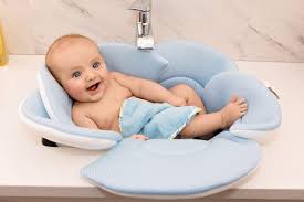 On the practical side, it's very lightweight and also has a plug, so if you're using it in the bath or sink you can easily let the water out to empty it or refill. Using A Baby Bath Sink Insert Baby Bath Moments