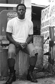 Hank Aaron sitting at a gas station in Mobile. AL.
