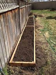 How To Build Raised Flower Beds Along Fence Google Search Landscaping Along Fence Backyard Landscaping Vegetable Garden Planning