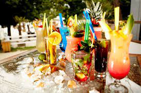 Regardless of whether it takes place inside or outside, these festive parties can feature brightly colored invitations and decorations, floral centerpieces, limbo contests, calypso and reggae music, and authentic food and drinks. Caribbean Dinner Party Drink Ideas Original Flava
