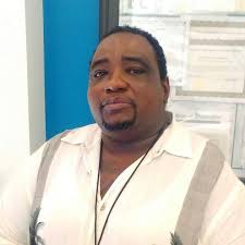 You would have to be an open wheel racer to know this man. His name is  Alvin Janson . He worked with Hoffman Auto Racing for many years as a pit  crew