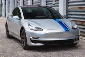 A trusted partner · rebranding solutions · custom solutions Miami Tesla Car Wraps Detailing Window Flim Pdr Clear Bra Mtm