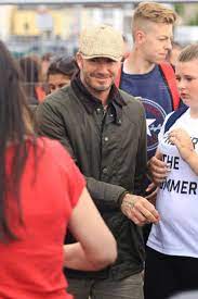David Beckham Wearing Barbour Jacket While Fishing With His Son Brooklyn Looklive Barbour Jacket Mens Outfits Beckham