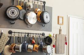 Hook the wiring up to the ceiling, running the cable through a cable canopy. Kitchen Wall Rack For Hanging Pots Pans Aprons And Other Utensils For Storage And Decor Stock Photo Image Of Decor Food 148186342