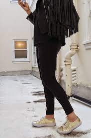 Gold Sneakers and Black Leather Fringe | Dena Julia | Ropa, Outfits  casuales, Zapatillas doradas