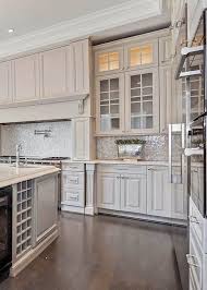Cream Kitchen Cabinets With Stone Countertops Tile Backsplash Stainless Appliances Wood Floor In 2020 Beige Kitchen Cream Kitchen Cabinets Kitchen Cupboard Colours