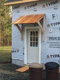 I want the awning to span from the left side of the door all the way over to cover the porch light, which both light and siding has been replaced since this pic was taken. Image Result For How To Build An Awning Over A Door Pergolareplacementcanopy Front Door Awning Diy Awning Door Overhang