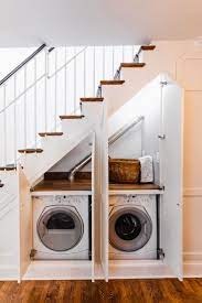10 Inventive Ideas For That Space Under The Stairs Hidden Laundry Rooms Space Under Stairs Stairs Design