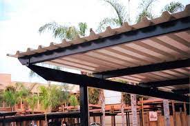 The boxed eave style metal carport can also be built with the vertical roof design. 5 All Steel Carport Designs Flat Roof Metal Carports Steel Carports Carport Designs