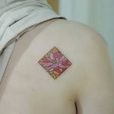 The colored glass reached its peak in popularity during the middle ages. Stained Glass Tattoo On The Shoulder Blade