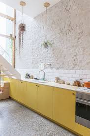 Yellow colored backsplash turns your drab kitchen into a bright area. 25 Yellow And White Kitchens That Raise The Mood Digsdigs