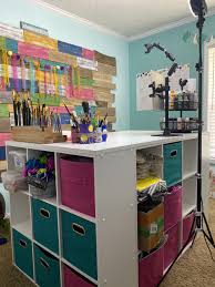 There are also kitchen cabinets towards the wall for a small pantry and hung up high for closed storage. Diy Desk Island For Your Craft Room Southern Adoornments Decor
