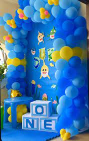 The colors of the space including black, white, and silver make a modern and stylish second birthday party. Baby Shark Party Ideas Baby Boy Birthday Cake Baby Boy Birthday Themes Birthday Themes For Boys