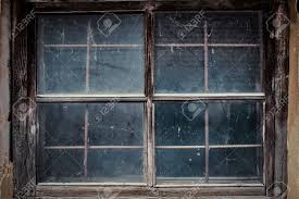 Down below the cars in the city go rushing by. Dirty Window In The Old House Shed Stock Photo Picture And Royalty Free Image Image 80102321