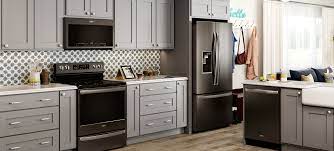 Comes with gray granite countertop and subway backsplash tile. Whirlpool Appliances Black Stainless W Light Gray Cabinets Patterned Backsplash Pho Appliances White Cabinets White Kitchen Appliances Light Gray Cabinets