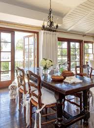 The juxtaposition of the rustic colonial dining table with the modern streamlined silhouette of their new west elm chandelier is perfect. A Fresh Take On A British Colonial Cottage Cottage Style Decorating Renovating And Entertaining Ideas For Indoors And Out