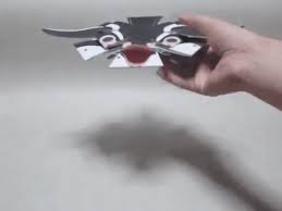Using creases made in previous step, fold down top edges. The Penguin Bomb A Flat Origami Penguin That Assembles Itself When Dropped On A Hard Surface