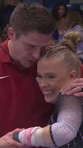 Joscelyn Roberson’s coach, Chris Brooks, was fired up after her uneven bars  routine!