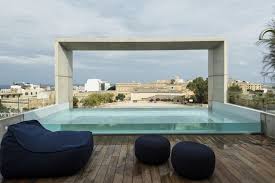 Rooftop swimming pools are something that many of us have only seen at expensive hotels. Contemporary House With A Transparent Rooftop Swimming Pool