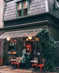 We Ve Got Big Love For This Tiny Cafe And Hotel Grab You Coffee Through The Window Or Set Up Camp In The Co Cozy Cafe Cozy Coffee Shop Cafe Interior