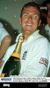 Alec Stewart looks rather happy after he was presented the Brian Johnstone  'champagne moment' award for his catch to dismiss Nathan Astle Stock Photo 