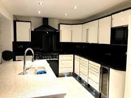 For contrast, the homeowner selected white marble countertops. Black And White Kitchen The Used Kitchen Company