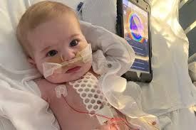 IVF baby born with 'half a heart' has had two ops but may need transplant  to save him