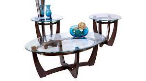 A sleek cappuccino and chrome finish adorn the base, adding structure to the modern marvel. 459 97 Haverhill Brown 3 Pc Table Set Glass Top Contemporary